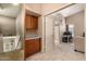 Hallway landing featuring built-in storage cabinet, counter space and access to room at 4212 W Jason Dr, Glendale, AZ 85308