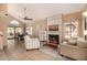 Open-concept living room featuring fireplace and dining area at 4212 W Jason Dr, Glendale, AZ 85308