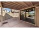 Covered patio with tiled flooring, sliding glass door, and views of the backyard at 4212 W Jason Dr, Glendale, AZ 85308