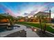 Landscaped backyard featuring a stone paver walkway, pool with water feature, and covered patio at 4223 N St Elias --, Mesa, AZ 85215
