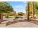Expansive backyard showcasing a sparkling pool, lush landscaping, and a charming outdoor living area at 4223 N St Elias --, Mesa, AZ 85215