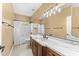 Bathroom showcasing double sinks with stylish fixtures and well-lit vanity lighting at 4223 N St Elias --, Mesa, AZ 85215