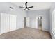 Expansive bedroom offering plush carpeting, a ceiling fan, walk-in closets and ensuite bathroom at 4223 N St Elias --, Mesa, AZ 85215