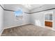 Spacious bedroom showcasing a large window and neutral carpeting, offering a serene atmosphere at 4223 N St Elias --, Mesa, AZ 85215