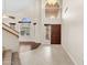 Inviting foyer featuring a high ceiling, tiled floors, and a grand entrance door at 4223 N St Elias --, Mesa, AZ 85215