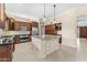 Spacious kitchen with a large island, custom cabinetry, stainless steel appliances, and modern lighting at 4223 N St Elias --, Mesa, AZ 85215