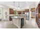 Gourmet kitchen featuring a center island with wine storage, granite countertops, and stainless steel appliances at 4223 N St Elias --, Mesa, AZ 85215