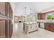 Modern kitchen with a central island, stainless steel appliances, and ample cabinet space at 4223 N St Elias --, Mesa, AZ 85215