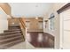 Spacious living room with hardwood floors, large windows offering natural light, and a staircase at 4223 N St Elias --, Mesa, AZ 85215