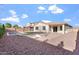 Spacious backyard with a pool, desert landscaping, patio, and lush green grass at 4360 N 186Th Ln, Goodyear, AZ 85395