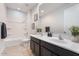 Clean bathroom with double sinks, framed mirror, and shower-tub combination at 4360 N 186Th Ln, Goodyear, AZ 85395