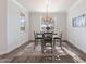 Cozy dining room with modern chandelier, rug, and natural light at 4360 N 186Th Ln, Goodyear, AZ 85395