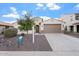 Charming single-story home with a two-car garage and low-maintenance landscaping at 4360 N 186Th Ln, Goodyear, AZ 85395