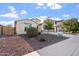Charming single-story home with a two-car garage and low-maintenance landscaping at 4360 N 186Th Ln, Goodyear, AZ 85395