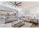 Open living room, featuring comfortable seating and a view of the kitchen at 4360 N 186Th Ln, Goodyear, AZ 85395