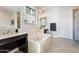 Luxurious main bathroom with a soaking tub, dual vanities, and glass enclosed shower at 4360 N 186Th Ln, Goodyear, AZ 85395