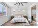 Sunny bedroom with natural light, wood-look floors, and neutral decor at 4360 N 186Th Ln, Goodyear, AZ 85395