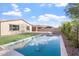 Sparkling pool is surrounded by desert landscaping, green grass and ample space for outdoor enjoyment at 4360 N 186Th Ln, Goodyear, AZ 85395