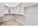 Spacious walk-in closet boasts custom shelving and ample hanging space for organized storage at 4360 N 186Th Ln, Goodyear, AZ 85395