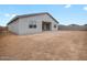 Spacious backyard with block wall fencing, offering potential for landscaping and outdoor living at 4777 W Hunter Trl, San Tan Valley, AZ 85144
