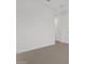 Minimalist bedroom featuring plush carpeting, white walls, and neutral trim at 4777 W Hunter Trl, San Tan Valley, AZ 85144