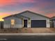 Charming single-story home featuring neutral paint, a two-car garage, and attractive desert landscaping at 4777 W Hunter Trl, San Tan Valley, AZ 85144