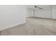 A spacious two-car garage with smooth concrete floors, ready for vehicles and storage at 4777 W Hunter Trl, San Tan Valley, AZ 85144