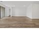 Spacious and bright living room with modern recessed lighting and stylish wood-look tile floors at 4777 W Hunter Trl, San Tan Valley, AZ 85144