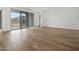 Open-concept living room with wood-look tile flooring and sliding glass doors at 4777 W Hunter Trl, San Tan Valley, AZ 85144