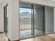 Close up of the sliding glass doors that overlook the backyard and mountain views at 4777 W Hunter Trl, San Tan Valley, AZ 85144