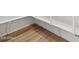 Pantry with custom white shelving and wood-look tile flooring at 4777 W Hunter Trl, San Tan Valley, AZ 85144