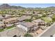 Aerial view of neighborhood featuring a gorgeous home with tile roof, landscaping, and inground pool at 5557 W Mine Trl, Phoenix, AZ 85083