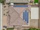 Aerial view of roof showcasing solar panels, a tile roof, and a large backyard at 5557 W Mine Trl, Phoenix, AZ 85083