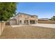 Expansive backyard featuring a huge gravel space and large covered patio area with multiple windows at 5557 W Mine Trl, Phoenix, AZ 85083
