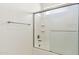 Clean white bathroom with a shower and tiled walls at 5557 W Mine Trl, Phoenix, AZ 85083