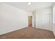 Neutral bedroom with carpet, dual sliding door closet and a second door at 5557 W Mine Trl, Phoenix, AZ 85083