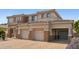 Charming home featuring multi-car garage, driveway, and appealing stonework at 5557 W Mine Trl, Phoenix, AZ 85083