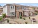 Upscale home featuring stone accents, tile roof, manicured landscaping, and a circular driveway at 5557 W Mine Trl, Phoenix, AZ 85083