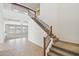 Grand foyer featuring a staircase with wooden banister and wrought iron, and tile flooring at 5557 W Mine Trl, Phoenix, AZ 85083