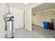 Well-lit garage featuring utility connections and access to house at 5557 W Mine Trl, Phoenix, AZ 85083