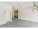 Clean garage with painted floors, ample space, and rear access door at 5557 W Mine Trl, Phoenix, AZ 85083