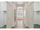 Hallway with walk-in closets and bathroom with soaking tub at 5557 W Mine Trl, Phoenix, AZ 85083