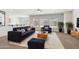 Inviting living room with modern furniture, plush rug, and ample natural light at 5557 W Mine Trl, Phoenix, AZ 85083