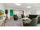 Spacious living room with vibrant accents, modern furniture, and plenty of seating at 5557 W Mine Trl, Phoenix, AZ 85083