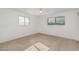 Neutral bedroom featuring two sunny windows, carpet flooring, and a ceiling fan at 6722 E El Paso St, Mesa, AZ 85205