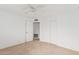 Spacious bedroom featuring neutral carpet, ceiling fan, and a large closet at 6722 E El Paso St, Mesa, AZ 85205