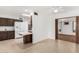 Open kitchen featuring white appliances, wood cabinets, and tiled floors at 6722 E El Paso St, Mesa, AZ 85205