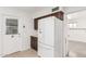 Bright kitchen featuring white appliances and access to the back yard at 6722 E El Paso St, Mesa, AZ 85205