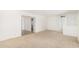 Bright, neutral living room with doorway and carpet is the perfect canvas for a modern design at 6722 E El Paso St, Mesa, AZ 85205