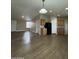 Living area showcasing open space, wood-look floors, and natural lighting at 6839 W Taylor St # 209, Phoenix, AZ 85043